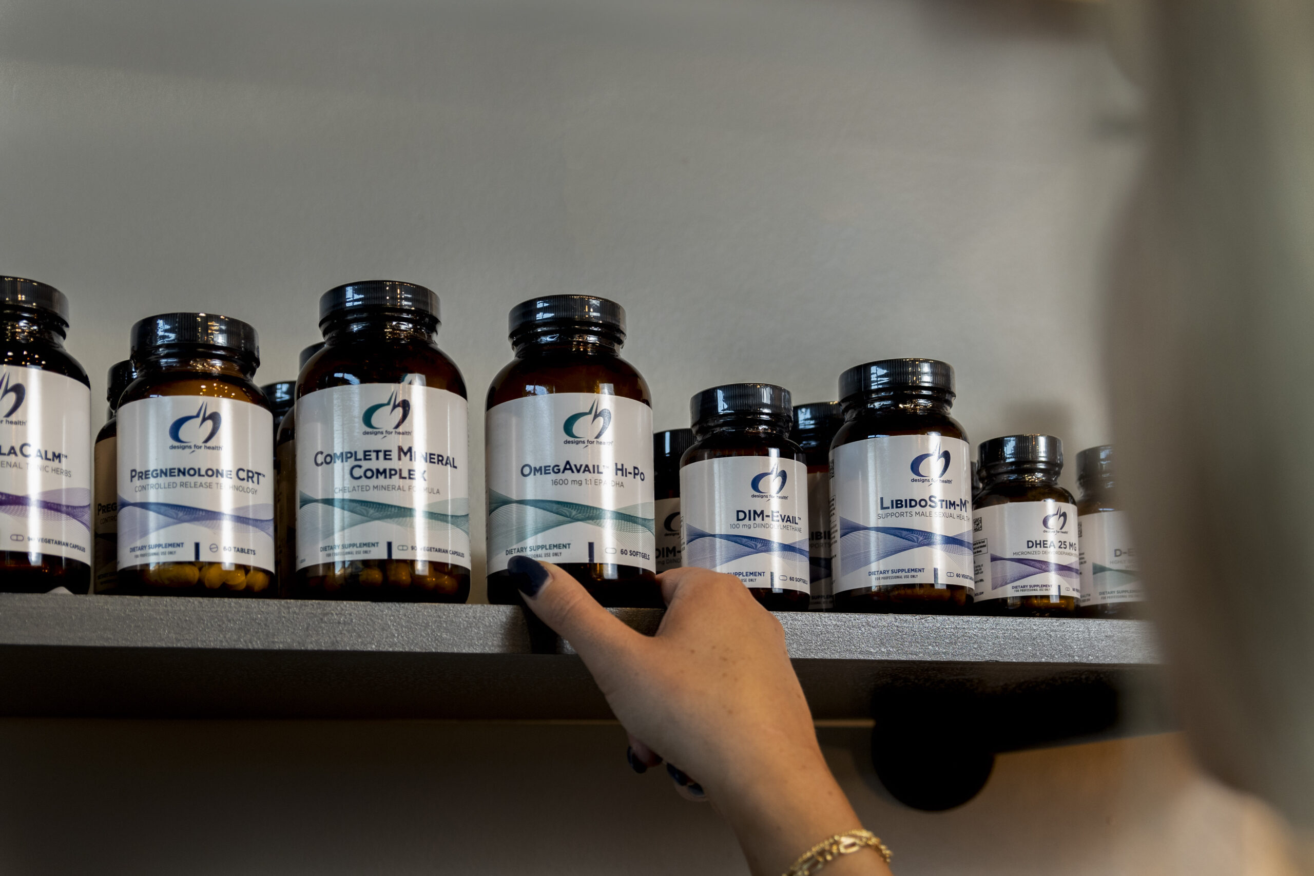 ngo-illustration-Artboard 5 Bottles of Designs for Health supplements arranged on a clean surface, showcasing professional packaging and health-focused labels.