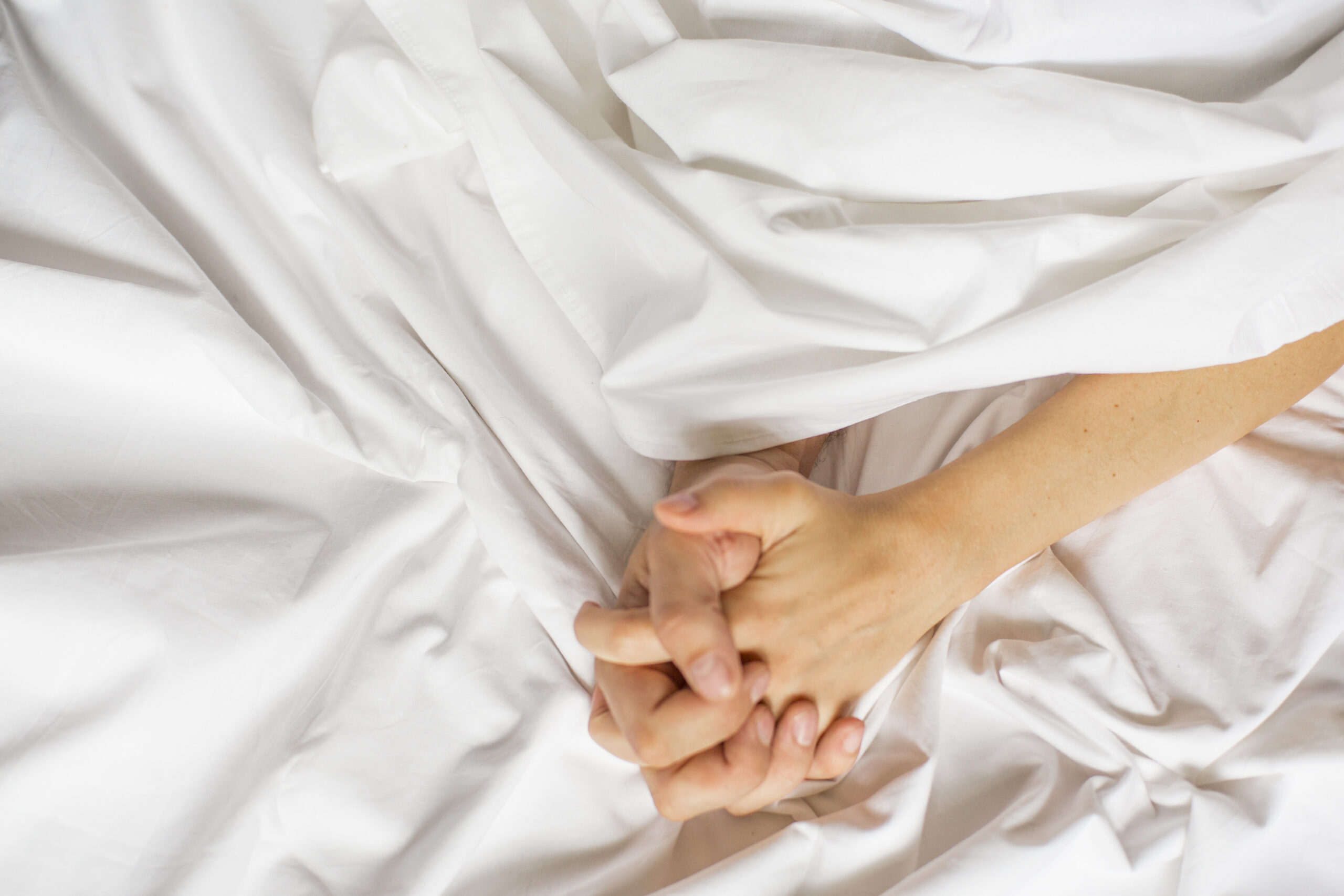 ngo-illustration-Artboard 5 Couple holding hands in bed.
